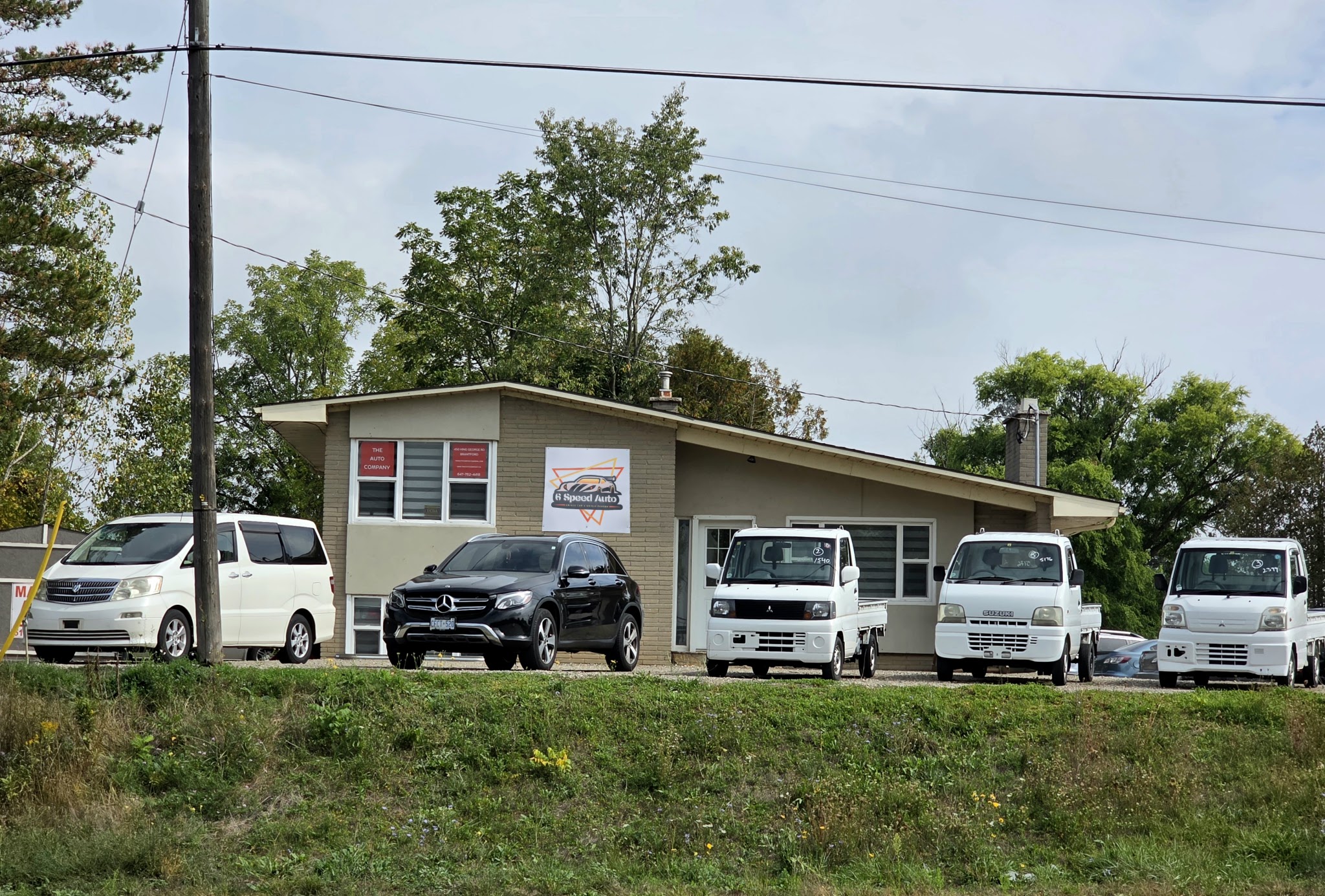 6 Speed Auto building with vehicles parked in front in Brantford